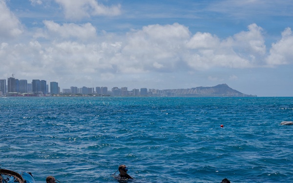Partner nations participate in a buoy restoration project during RIMPAC 26