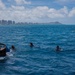 Partner nations participate in a buoy restoration project during RIMPAC 26