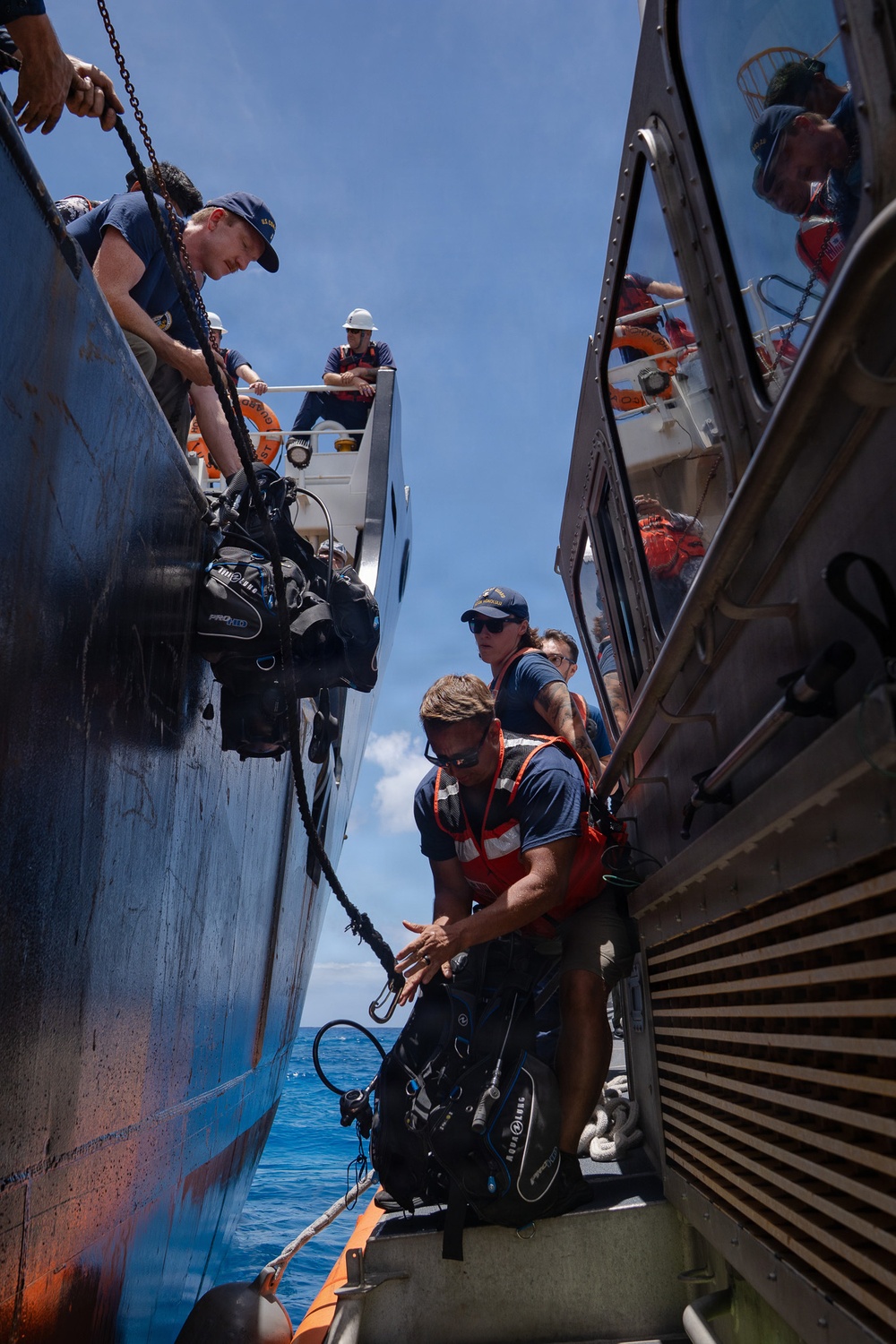Partner nations participate in a buoy restoration project during RIMPAC 26