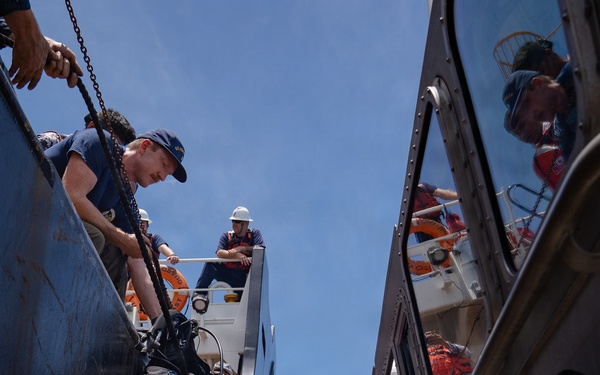 Partner nations participate in a buoy restoration project during RIMPAC 26