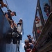 Partner nations participate in a buoy restoration project during RIMPAC 26