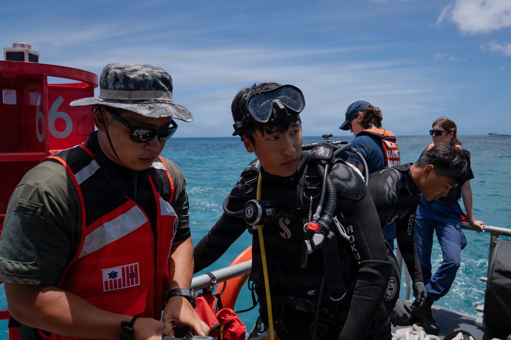 Partner nations participate in a buoy restoration project during RIMPAC 26