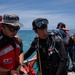Partner nations participate in a buoy restoration project during RIMPAC 26