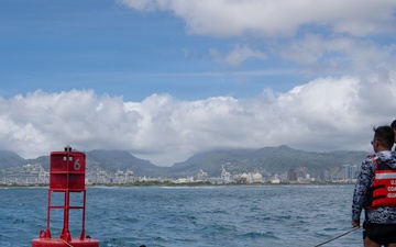Partner nations participate in a buoy restoration project during RIMPAC 26