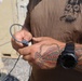 US Navy Sailor ties a uni knot on detonating cord