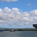 Tugboats escort hulk of decommissioned USS Peleliu during RIMPAC 26