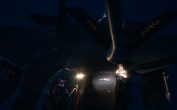 KC-135 refuels F-15s during night operations in CENTCOM AOR