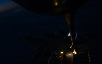 KC-135 refuels F-15s during night operations in CENTCOM AOR