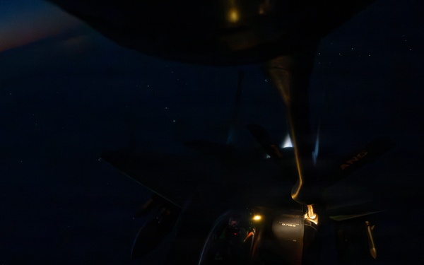 KC-135 refuels F-15s during night operations in CENTCOM AOR