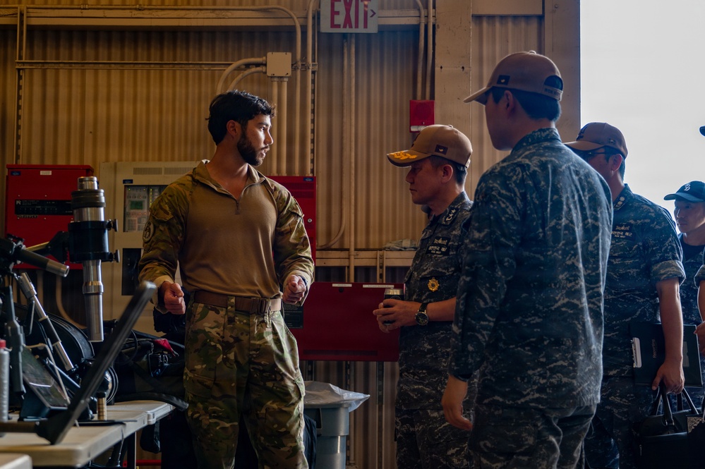 ROK Rear Adm. Inho Kim attends DV tour at Navy Expeditionary compound during RIMPAC 2026