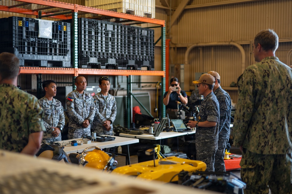 ROK Rear Adm. Inho Kim attends DV tour at Navy Expeditionary compound during RIMPAC 2026