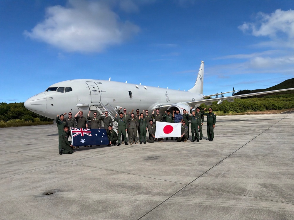 Japan Maritime Self-Defense Force and Royal Australian Navy aviation personnel pose for a group photo during RIMPAC 2026