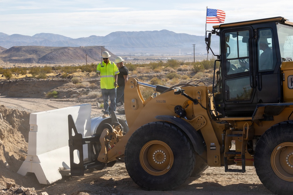 Base Maintenance and Engineering Department work to repair a washed-out section of Range Road aboard Marine Corps Logistics Base Barstow