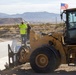 Base Maintenance and Engineering Department work to repair a washed-out section of Range Road aboard Marine Corps Logistics Base Barstow