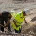 Base Maintenance and Engineering Department work to repair a washed-out section of Range Road aboard Marine Corps Logistics Base Barstow,