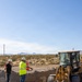 Personnel with the Base Maintenance and Engineering Department work to repair a washed-out section of Range Road aboard Marine Corps Logistics Base Barstow
