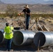 Base Maintenance and Engineering Department work to repair a washed-out section of Range Road aboard Marine Corps Logistics Base Barstow