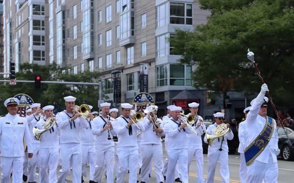 Navy Band Northeast proudly marched through downtown Boston during the Crew and Cadet Parade as part of Sail Boston