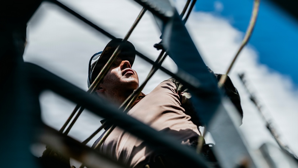 Multinational EOD technicians participate in rigging and ordnance extraction training