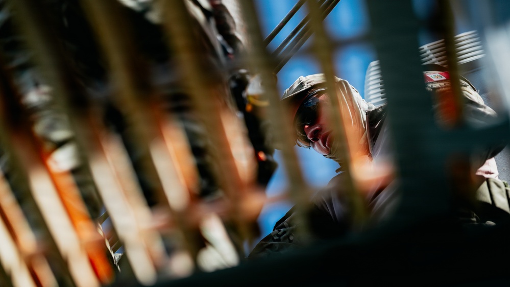 Multinational EOD technicians participate in rigging and ordnance extraction training