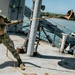 Multinational EOD technicians participate in rigging and ordnance extraction training