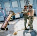 Multinational EOD technicians participate in rigging and ordnance extraction training