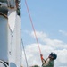 Multinational EOD technicians participate in rigging and ordnance extraction training