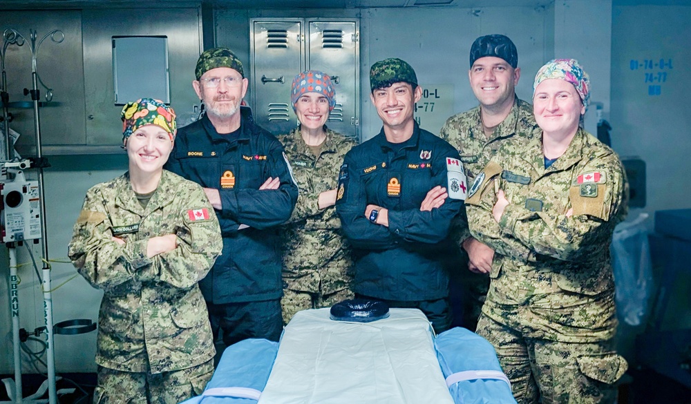 Canadian Forward Surgical Team pose for a photo aboard USS Essex during RIMPAC 2026