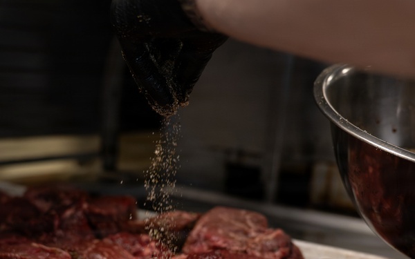 USCGC Eagle culinary specialists prepare a meal at sea