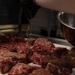 USCGC Eagle culinary specialists prepare a meal at sea