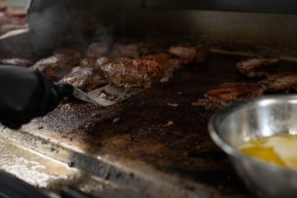 USCGC Eagle culinary specialists prepare a meal at sea