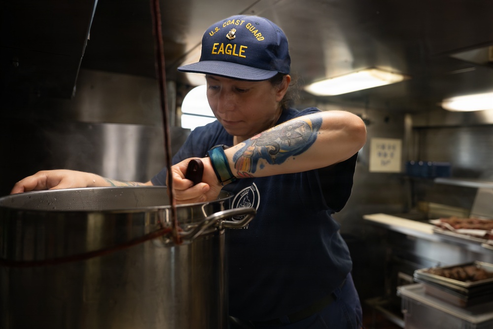 USCGC Eagle culinary specialists prepare a meal at sea