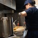 USCGC Eagle culinary specialists prepare a meal at sea