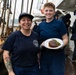 USCGC Eagle culinary specialists prepare a meal at sea
