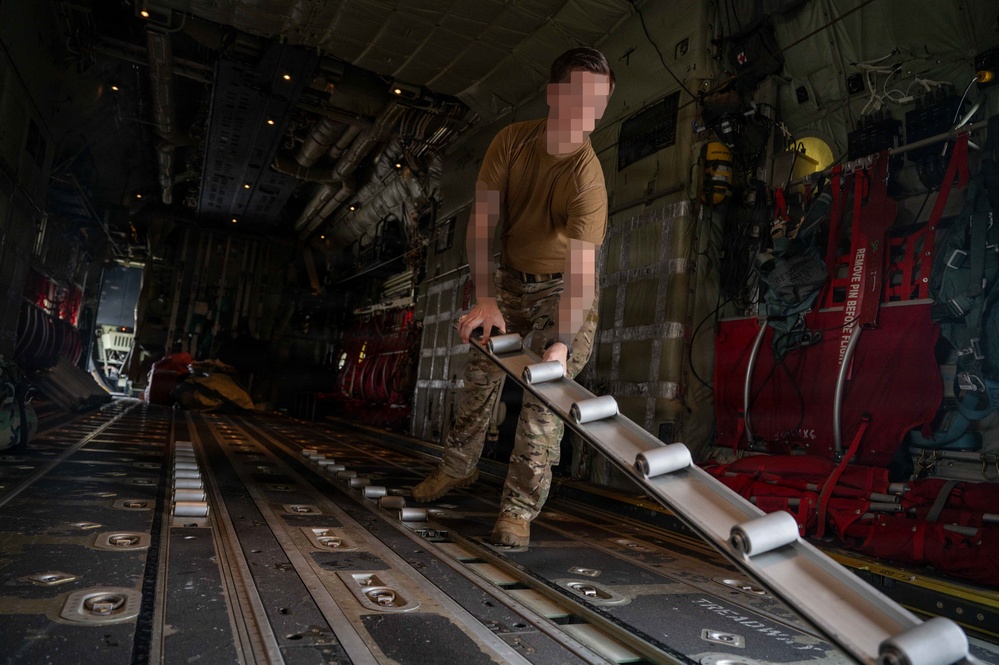 AFSOC MC-130J conducts nighttime air drops