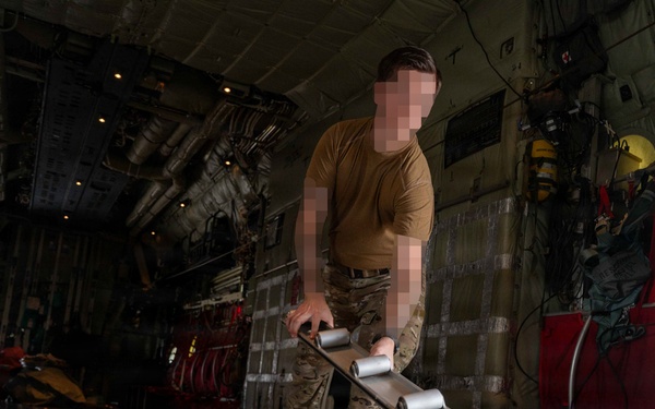 AFSOC MC-130J conducts nighttime air drops