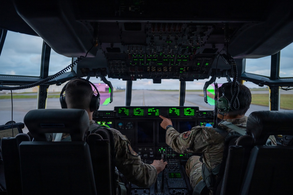 AFSOC MC-130J conducts nighttime air drops