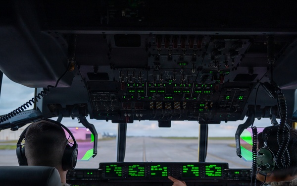 AFSOC MC-130J conducts nighttime air drops