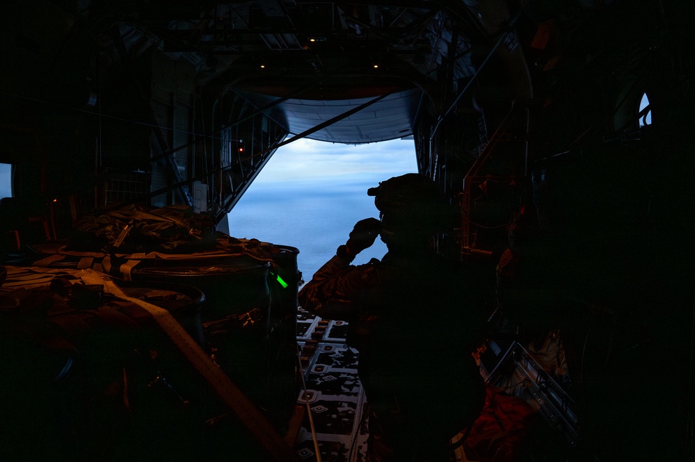 AFSOC MC-130J conducts nighttime air drops