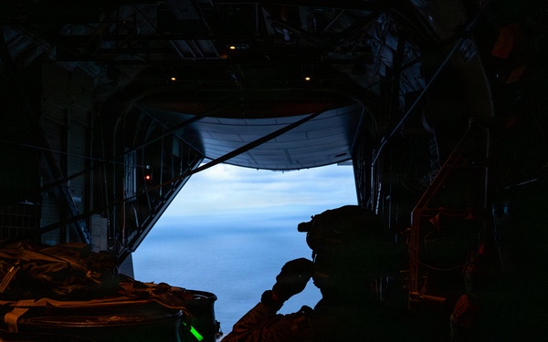 AFSOC MC-130J conducts nighttime air drops