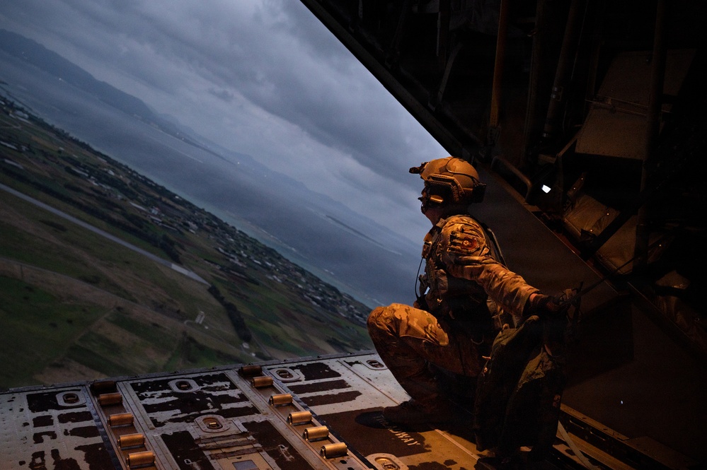 AFSOC MC-130J conducts nighttime air drops