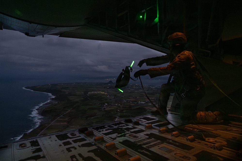 AFSOC MC-130J conducts nighttime air drops