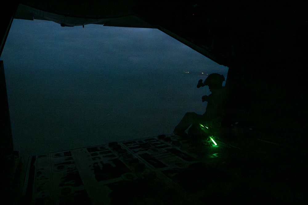 AFSOC MC-130J conducts nighttime air drops