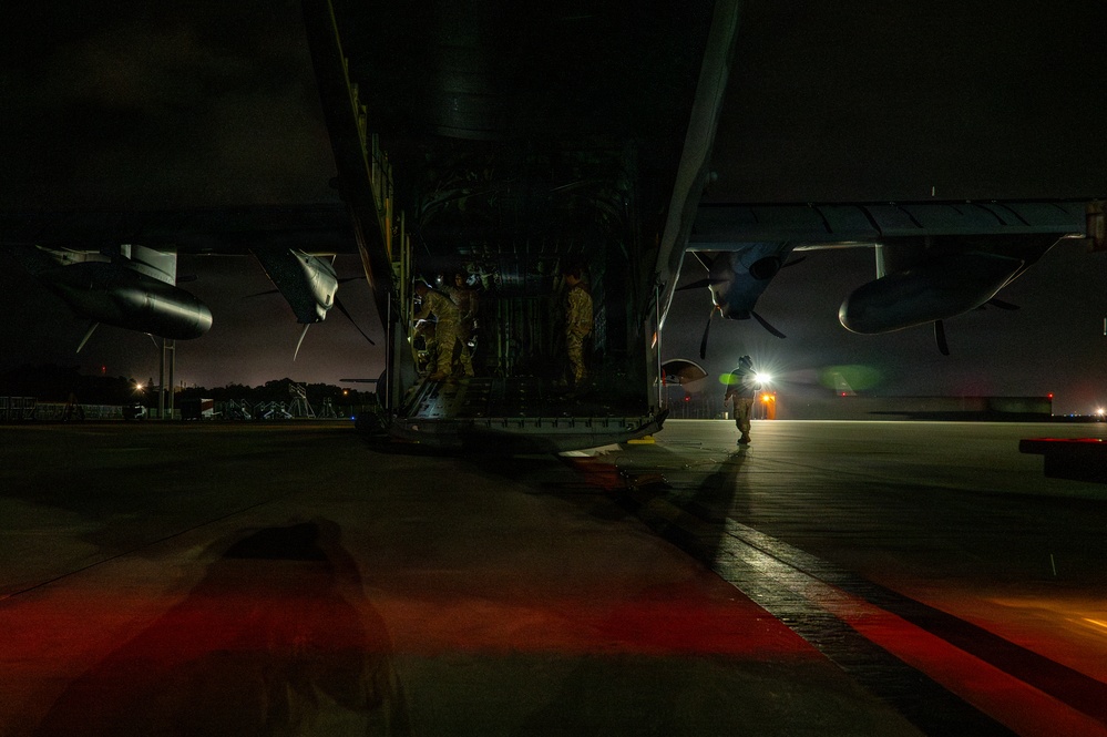 AFSOC MC-130J conducts nighttime air drops