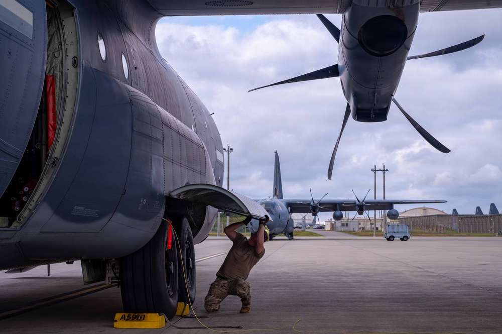 AFSOC MC-130J conducts nighttime air drops