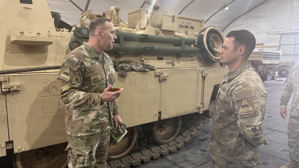 Gunner NCOs receive RFCT coins from CSM Jeremiah A. Enfield on behalf of COL Richard A. Montcalm