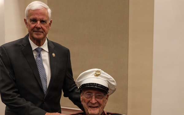 LtGen Matos hosts the U.S. Rep Steve Womack at an indoor Evening Parade