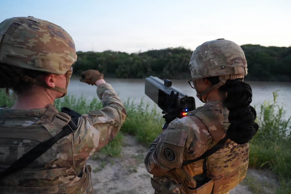 U.S. Army Soldiers with the 1729th Support Maintenance Company demonstrate the Dronebuster