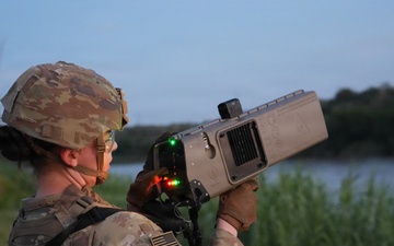 U.S. Army Soldiers with the 1729th Support Maintenance Company demonstrate the Dronebuster