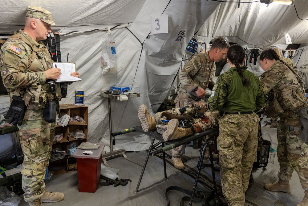 Global Medic Personnel Treat Simulated Casualty